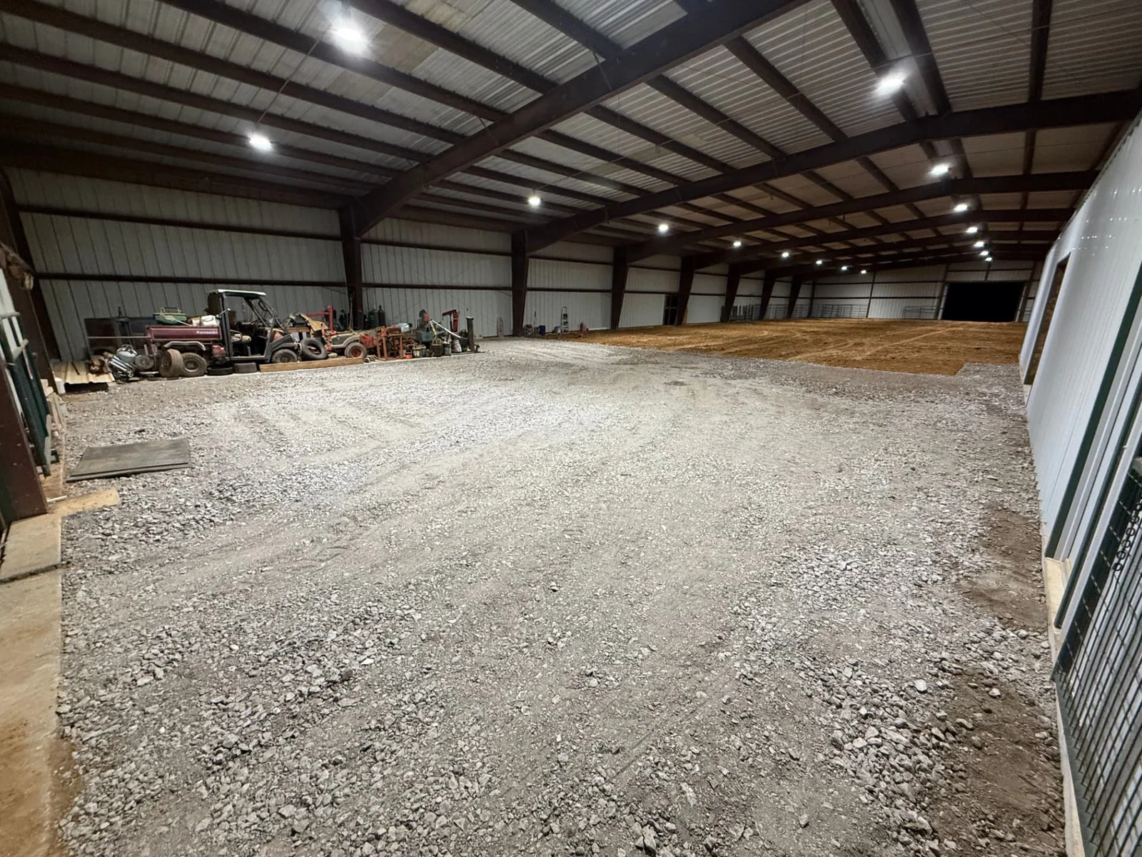 Compacted flex base surface graded to drain on a ranch parking and access area