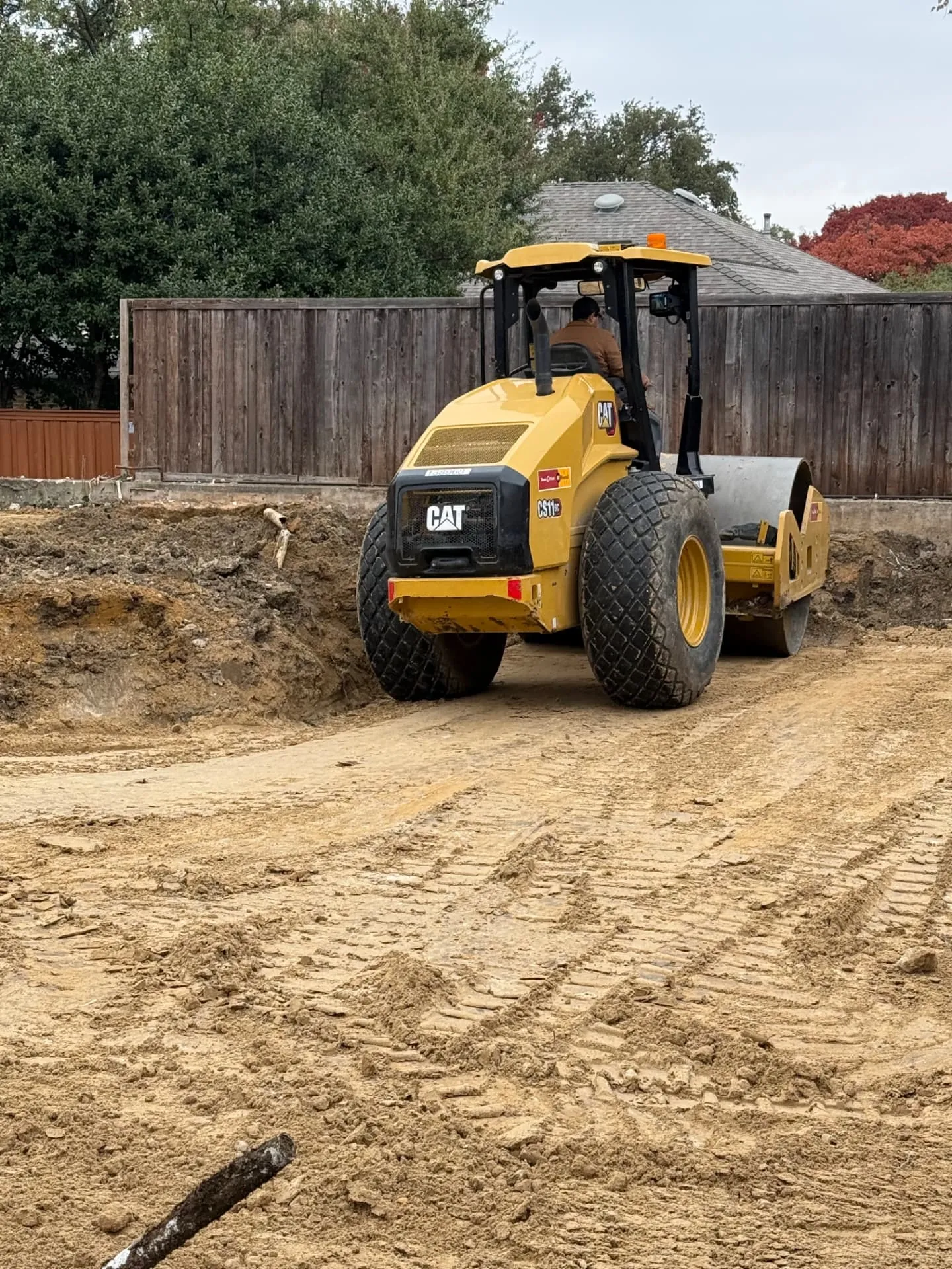 Long rural driveway base graded level and ready for surfacing