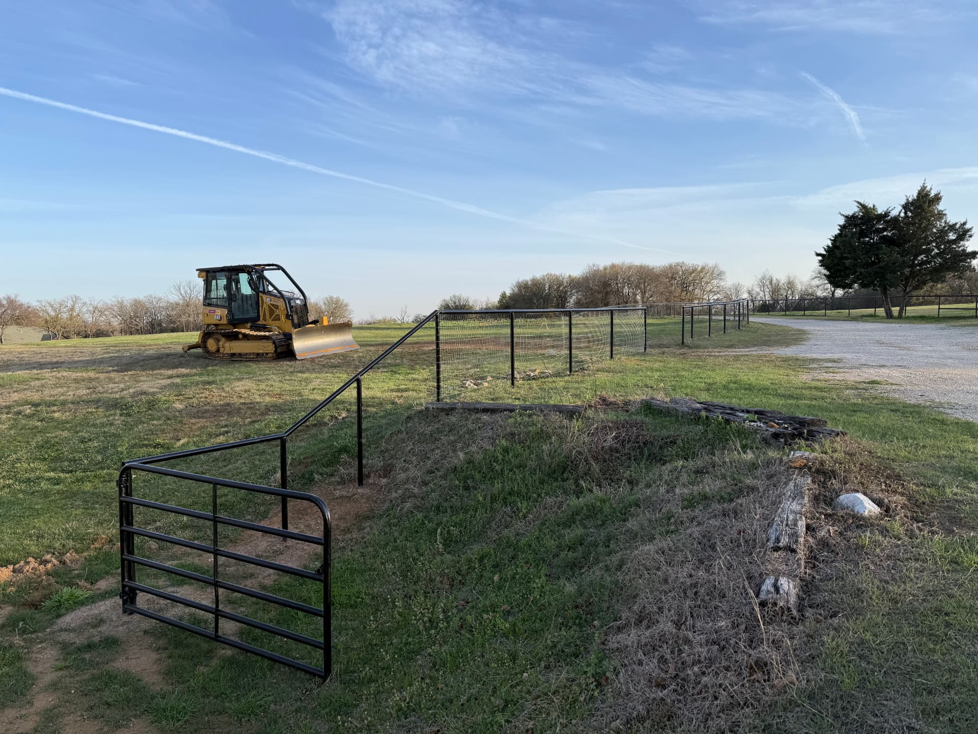 Dozer preparing a building pad on a rural North Texas property