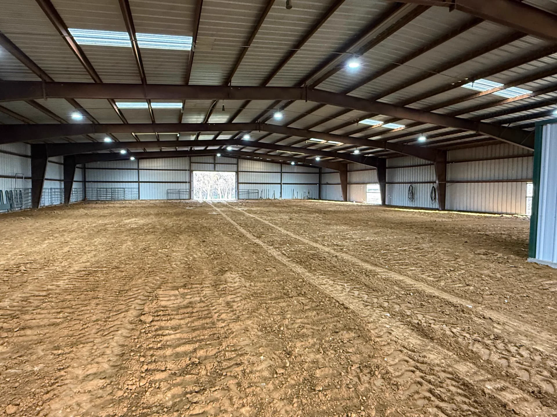 Refurbished horse arena floor after grading and new footing in Aubrey, Texas
