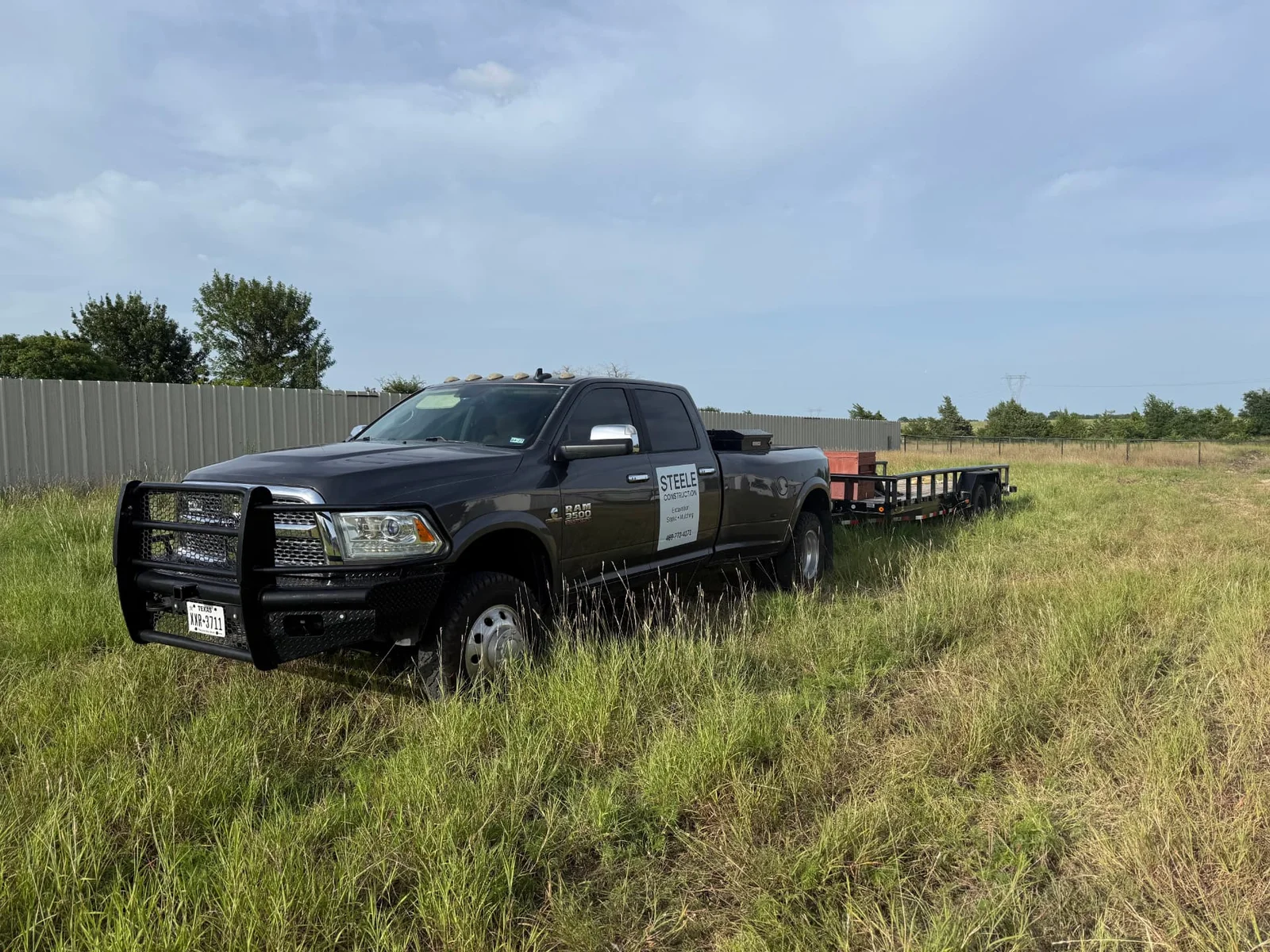 Steele Construction truck parked in a freshly mowed Weston, Texas pasture