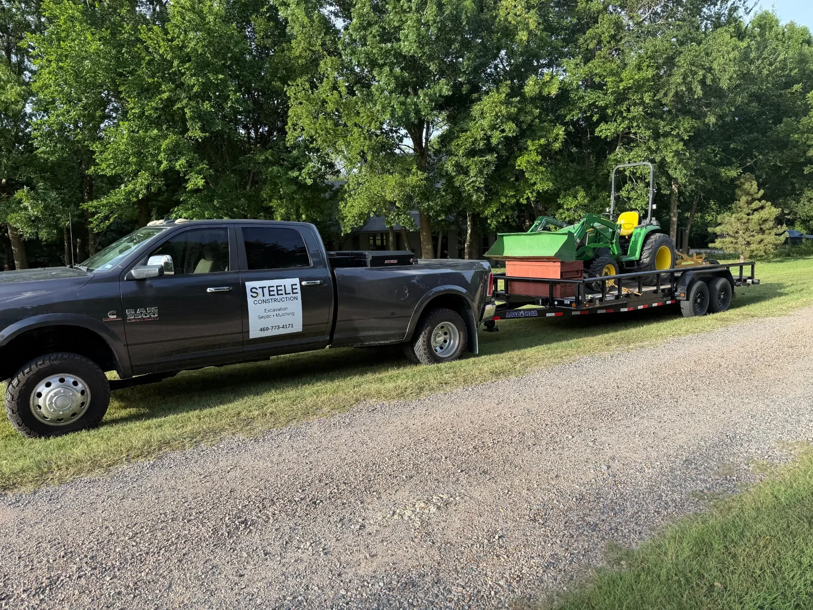 Tractor and brush hog on a trailer ready for acreage mowing in Melissa, Texas